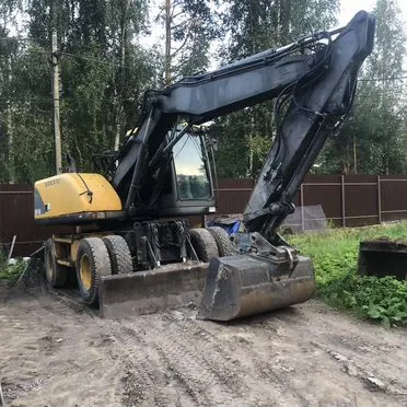 Колёсный экскаватор Volvo EW140, 2000